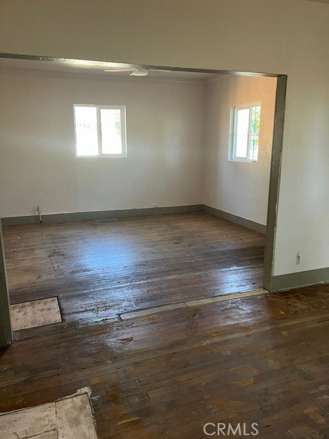 2294 Mulberry Street Chico, CA 95928 - Photo 4 of 16 an empty room with wooden floor and windows