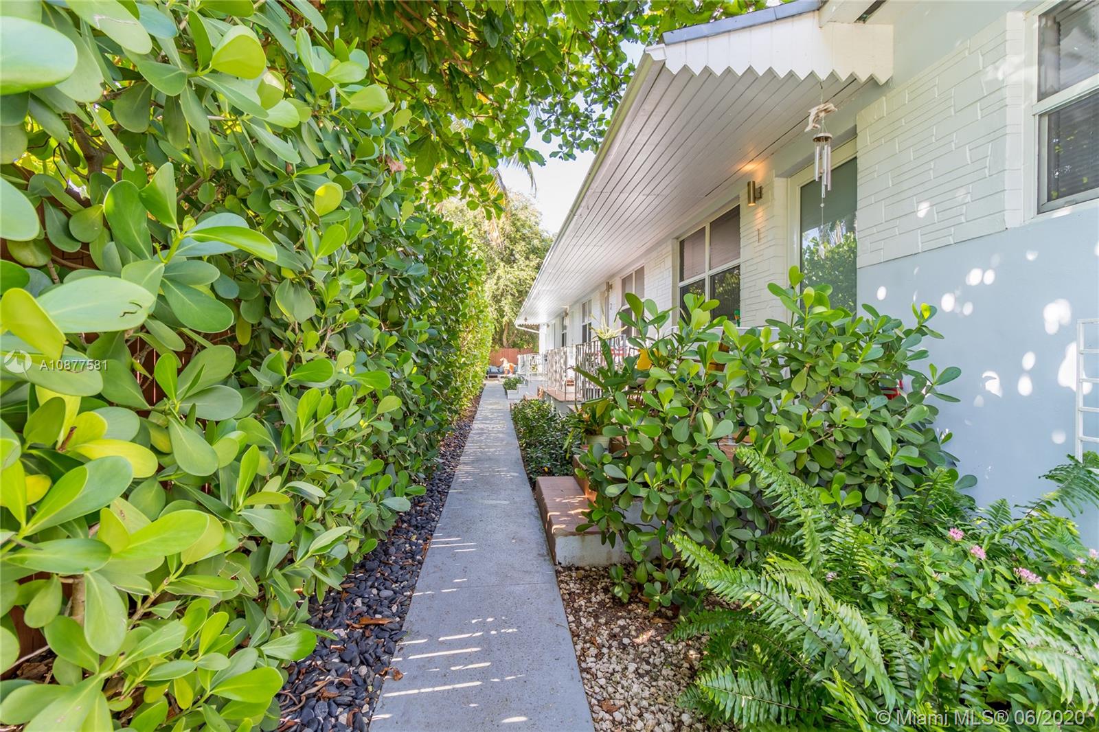 424 Northeast 64th Street, Unit 2 Miami, FL 33138 - Photo 2 of 11 a view of a pathway with plants