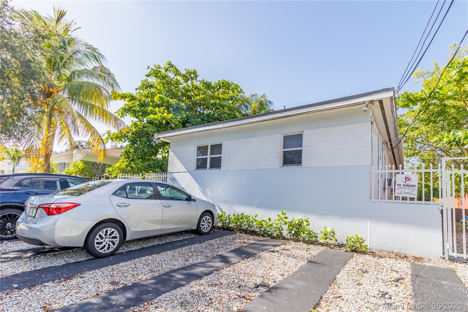 424 Northeast 64th Street, Unit 2 Miami, FL 33138 - Photo 5 of 11 a view of a car in front of a house