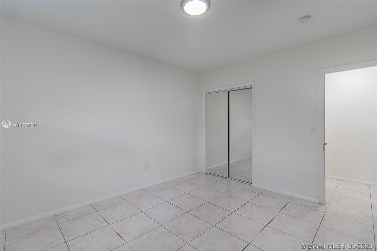 424 Northeast 64th Street, Unit 2 Miami, FL 33138 - Photo 7 of 11 a view of an empty room and window