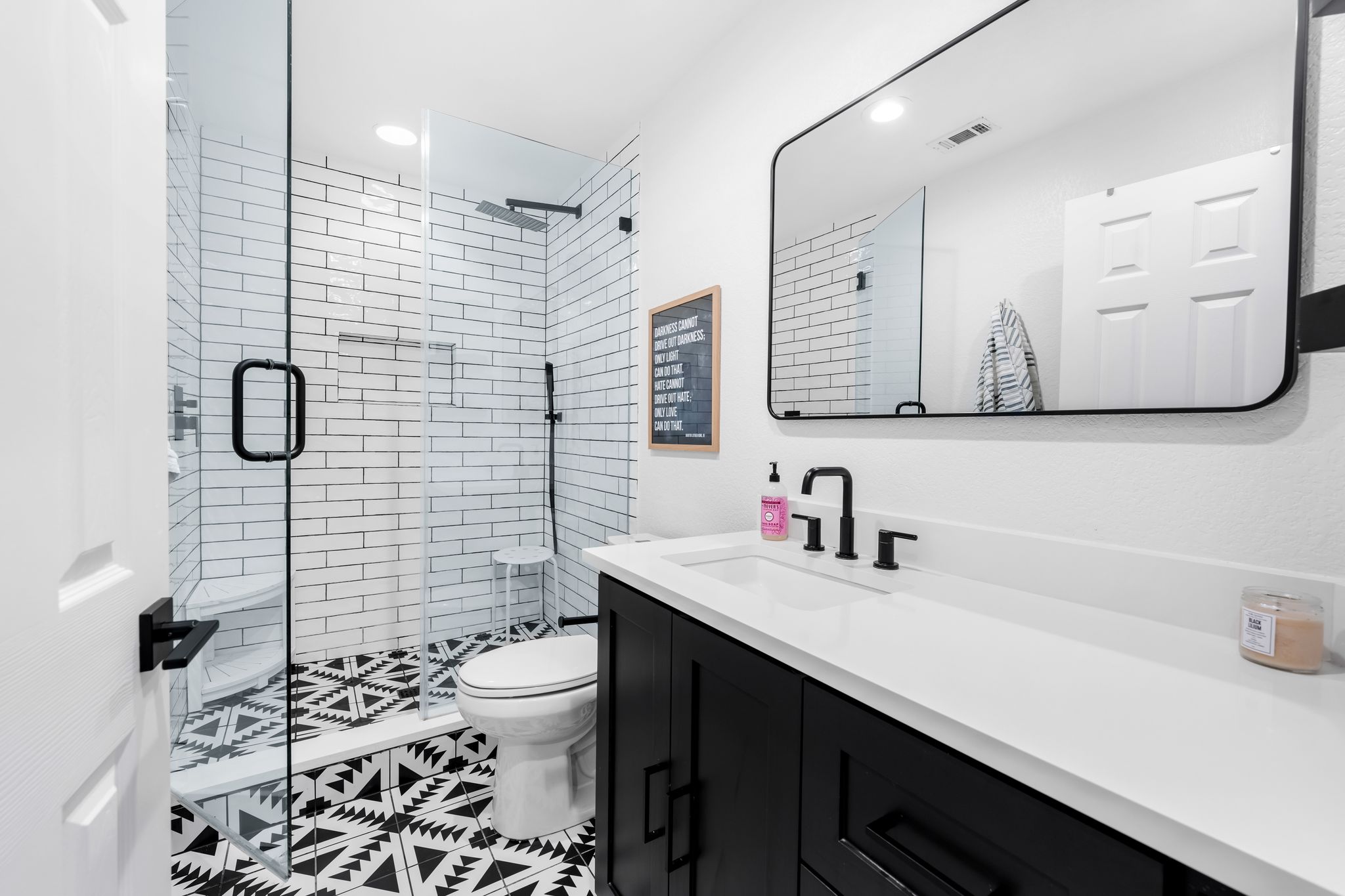 2204 Rimrock Drive Austin, TX 78738 - Photo 25 of 39 Graphic pattern flooring meets white subway tile in this modern bathroom.