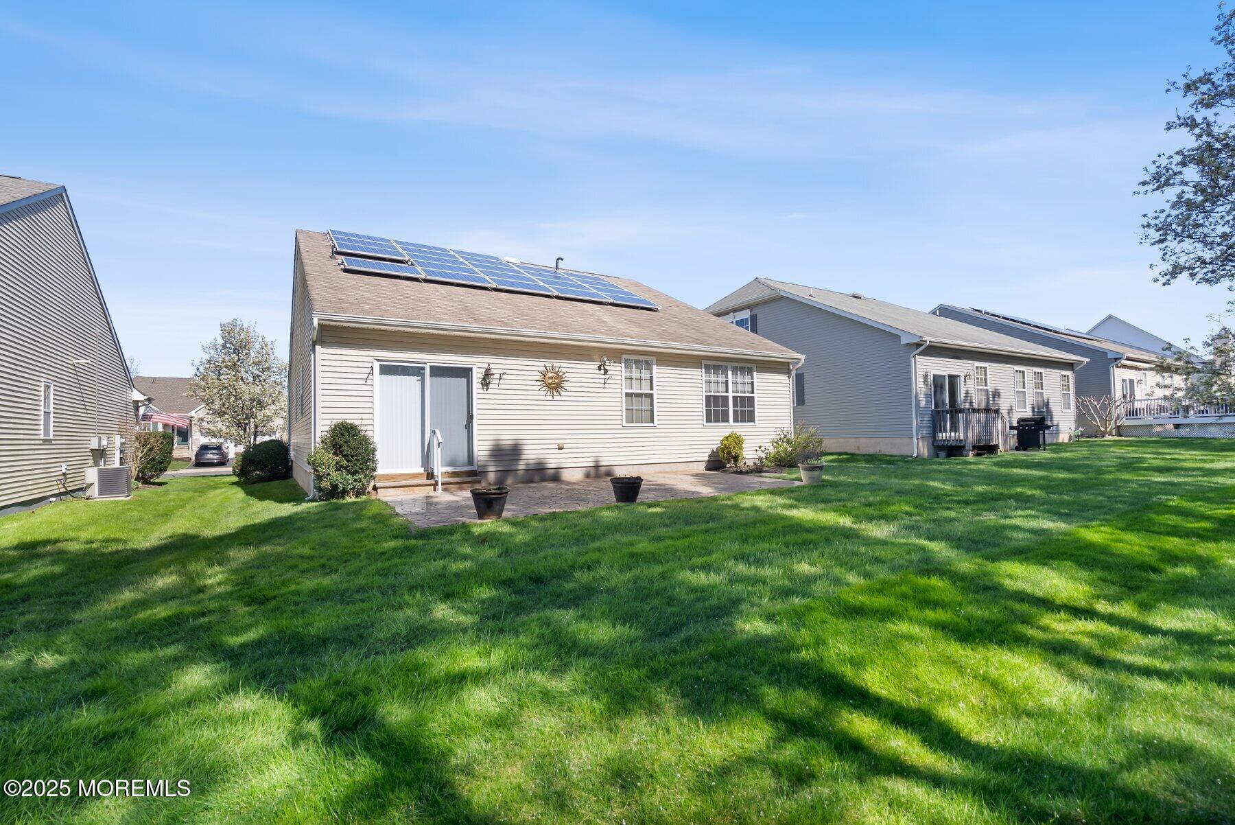 24 Little Leaf Lane Howell, NJ 07731 - Photo 30 of 32 a view of a house with a backyard porch and sitting area