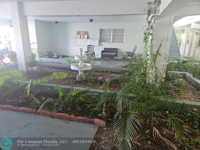2404 Northeast 33rd Avenue, Unit 12 Fort Lauderdale, FL 33305 - Photo 12 of 13 a living room with furniture