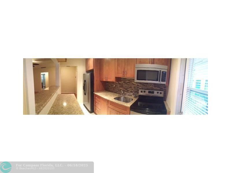 2404 Northeast 33rd Avenue, Unit 12 Fort Lauderdale, FL 33305 - Photo 4 of 13 a picture of a living room with a sink