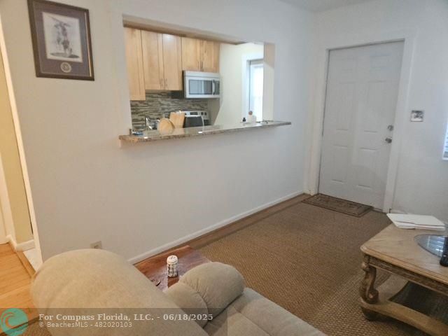 2404 Northeast 33rd Avenue, Unit 12 Fort Lauderdale, FL 33305 - Photo 6 of 13 a kitchen with a sink cabinets and appliances