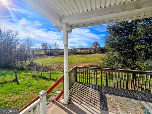 a view of a lake with houses in the back