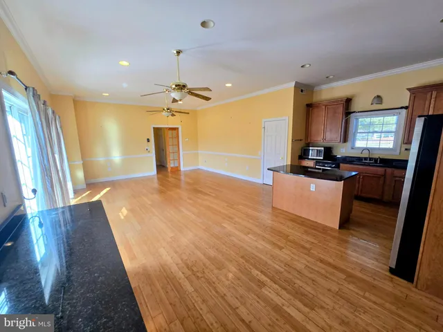 a view of a livingroom with furniture and wooden floor