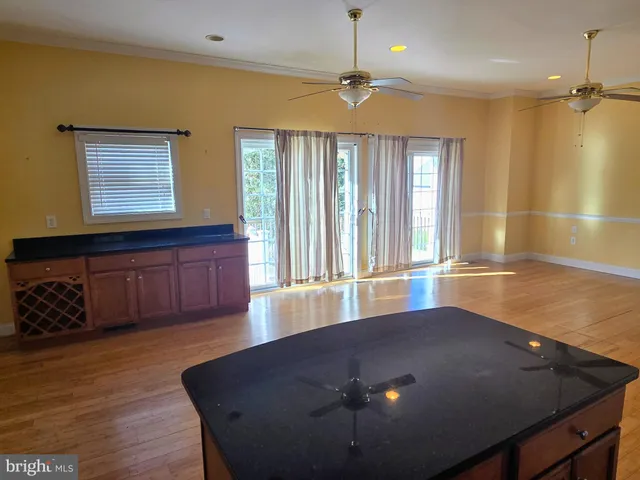 a view of an entryway with wooden floor