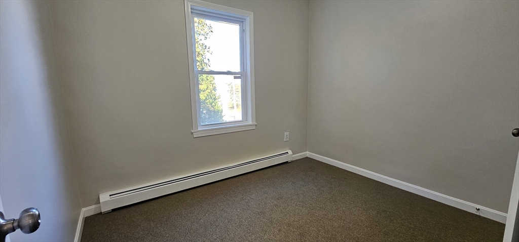 20 Park Avenue, Unit 1 Webster, MA 01570 - Photo 11 of 20 an empty room with a window