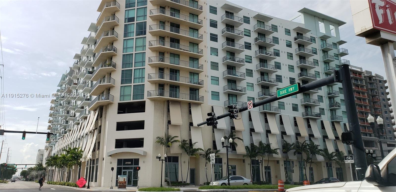 a view of a building with a street