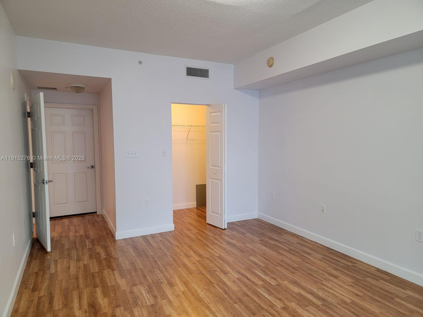 140 South Dixie Highway, Unit 908 Hollywood, FL 33020 - Photo 13 of 28 a view of empty room with wooden floor and closet