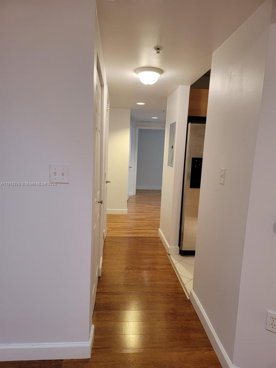140 South Dixie Highway, Unit 908 Hollywood, FL 33020 - Photo 16 of 28 a view of a hallway with wooden floor