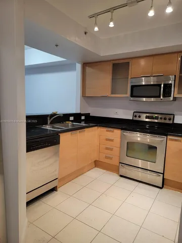 a view of room with a desk and chair