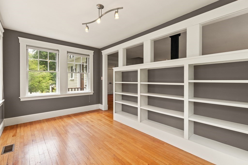 16 Anthony Road Bedford, MA 01730 - Photo 12 of 19 a view of an empty room with a window and wooden floor