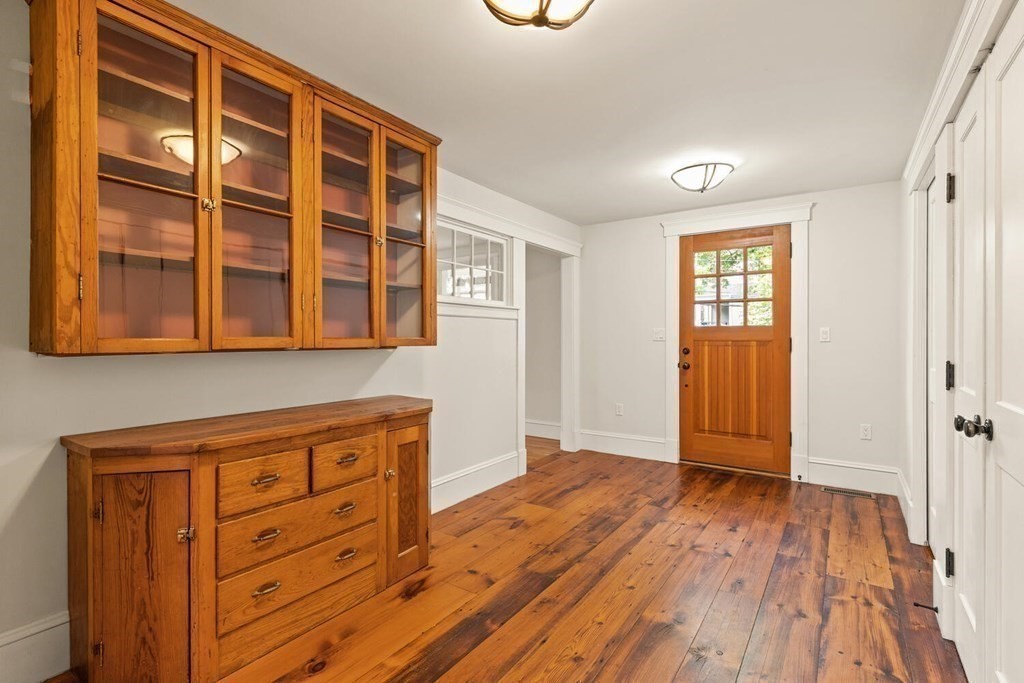 16 Anthony Road Bedford, MA 01730 - Photo 4 of 19 wooden floor in an entryway with a window
