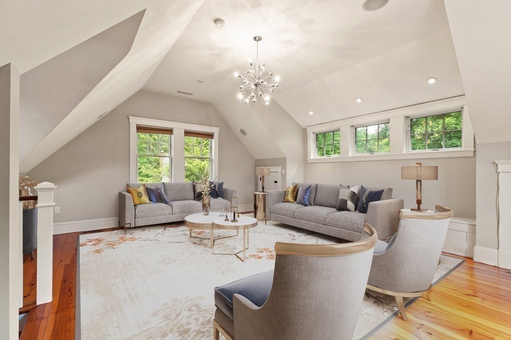 16 Anthony Road Bedford, MA 01730 - Photo 9 of 19 a living room with fireplace furniture and a large window