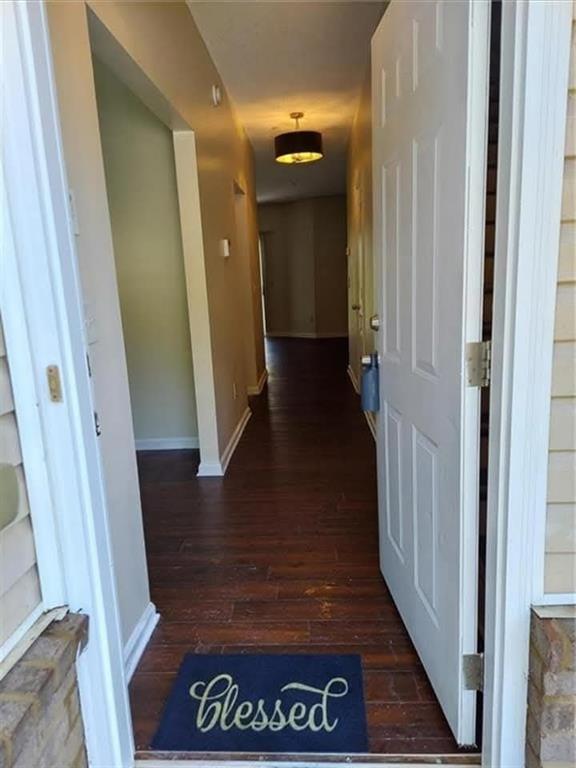 1749 Broad River Road Atlanta, GA 30349 - Photo 2 of 10 a view of a hallway with wooden floor and stairs