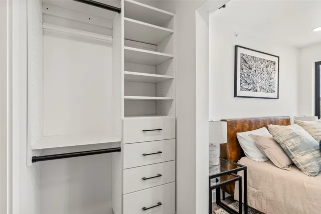 a bathroom with a double vanity sink toilet and a mirror