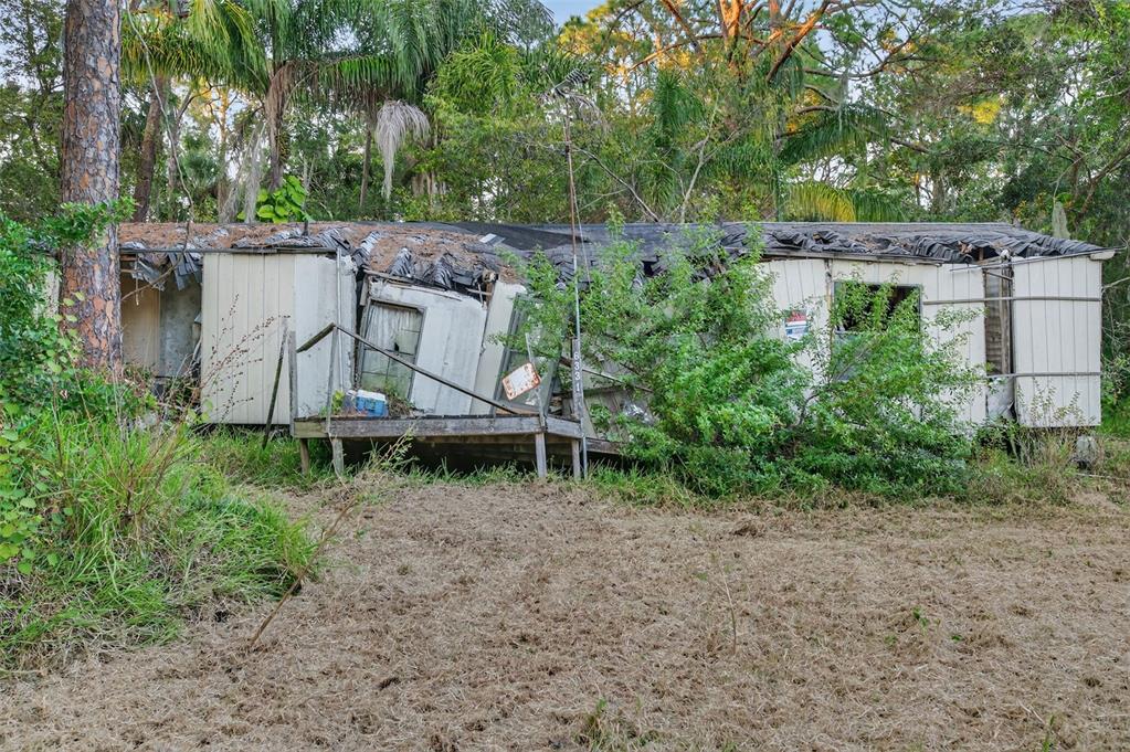 6331 Lost Trail New Port Richey, FL 34653 - Photo 11 of 19 an aerial view of a house with a yard