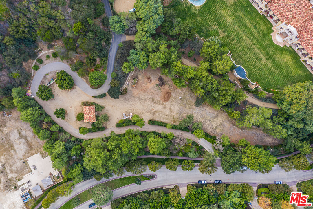 64 Beverly Park Beverly Hills, CA 90210 - Photo 1 of 7 an aerial view of a house with a yard