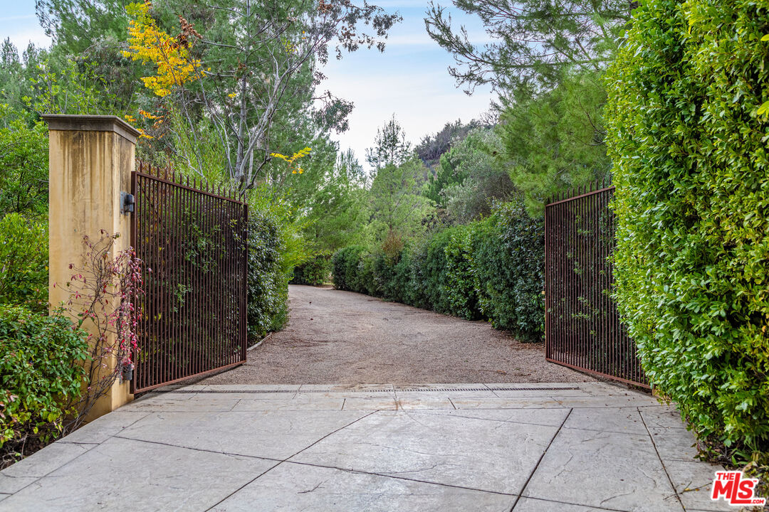 64 Beverly Park Beverly Hills, CA 90210 - Photo 2 of 7 a view of a house with a backyard