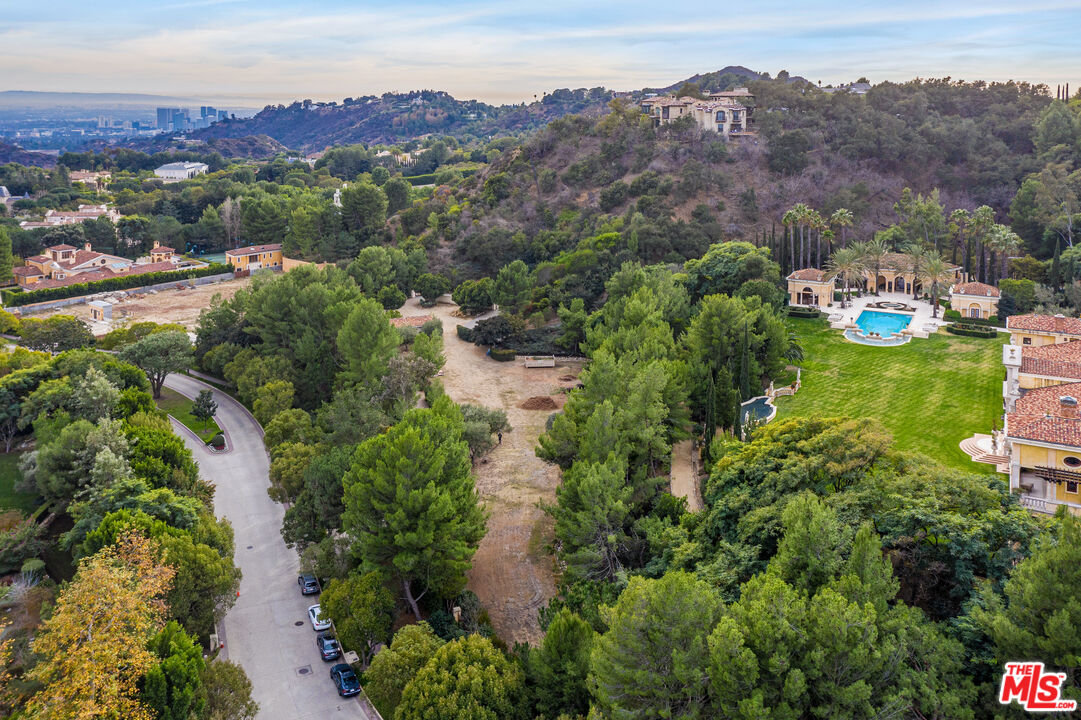 64 Beverly Park Beverly Hills, CA 90210 - Photo 7 of 7 an aerial view of green landscape with trees houses and mountain view