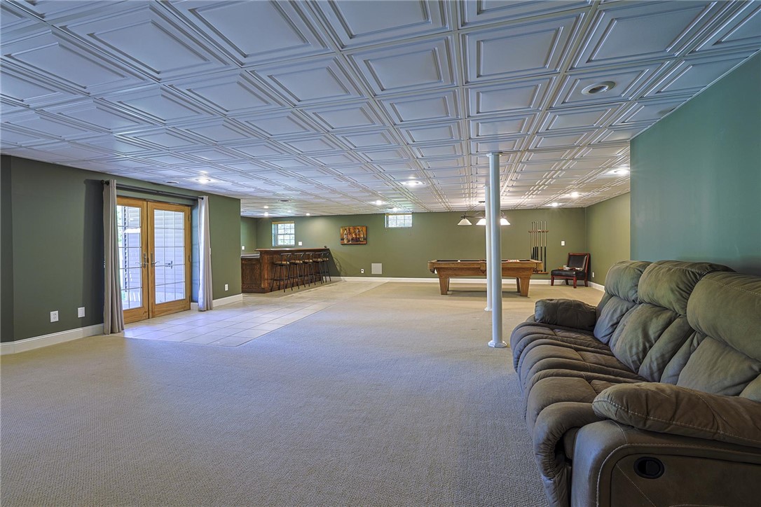 3681 Wilmington Road Lebanon, OH 45036 - Photo 43 of 87 This spacious recreational area features a bar, pool table, and ample room for relaxation and entertaining.