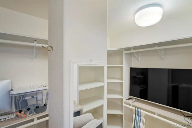 a view of an empty walk in closet