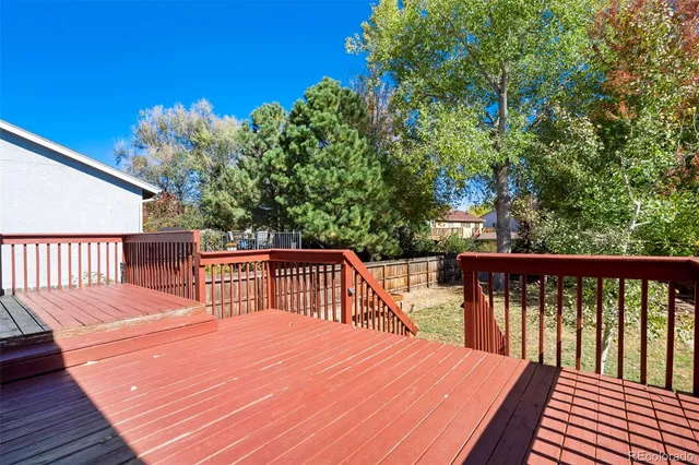 a balcony with wooden floor