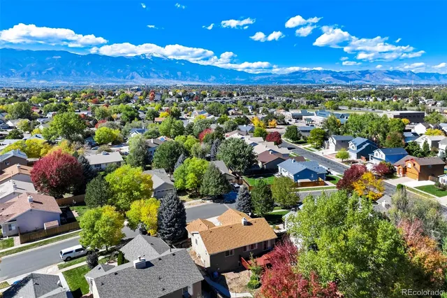 an aerial view of multiple houses with outdoor space