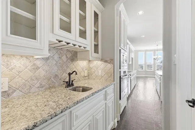 a kitchen with sink and faucet