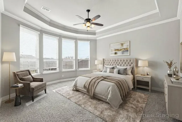 a spacious bedroom with a bed and a couch