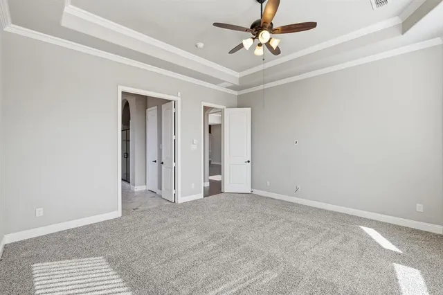 a view of a livingroom with a ceiling fan