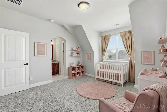 a bedroom with furniture and a window