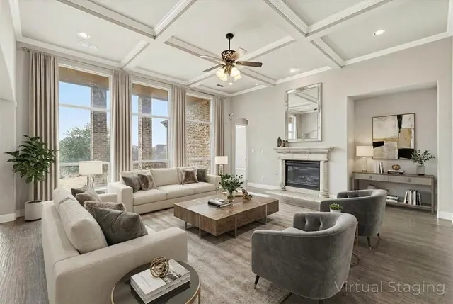 a living room with furniture a fireplace and a chandelier