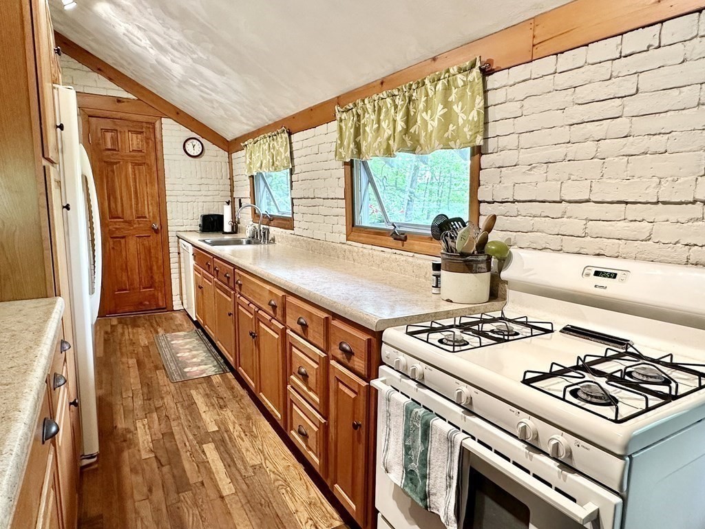 100 Aberdeen Road Goshen, MA 01096 - Photo 11 of 27 a kitchen with stainless steel appliances a stove a sink and a refrigerator