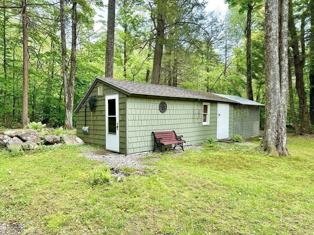 100 Aberdeen Road Goshen, MA 01096 - Photo 24 of 27 a backyard of a house with yard and trampoline