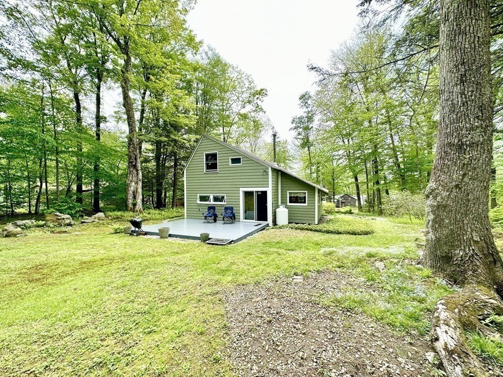 100 Aberdeen Road Goshen, MA 01096 - Photo 26 of 27 a house view with a sitting space and garden