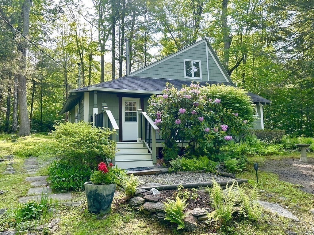 100 Aberdeen Road Goshen, MA 01096 - Photo 27 of 27 a front view of a house with a yard and potted plants