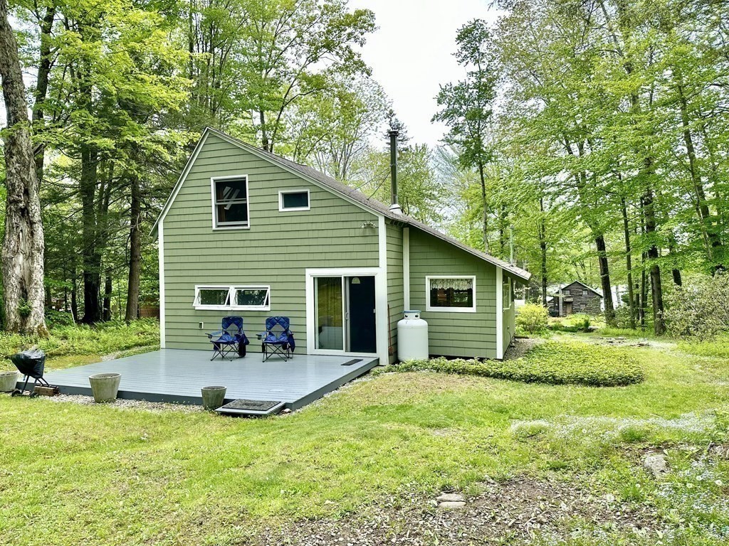 100 Aberdeen Road Goshen, MA 01096 - Photo 3 of 27 a view of backyard of house with outdoor seating and green space