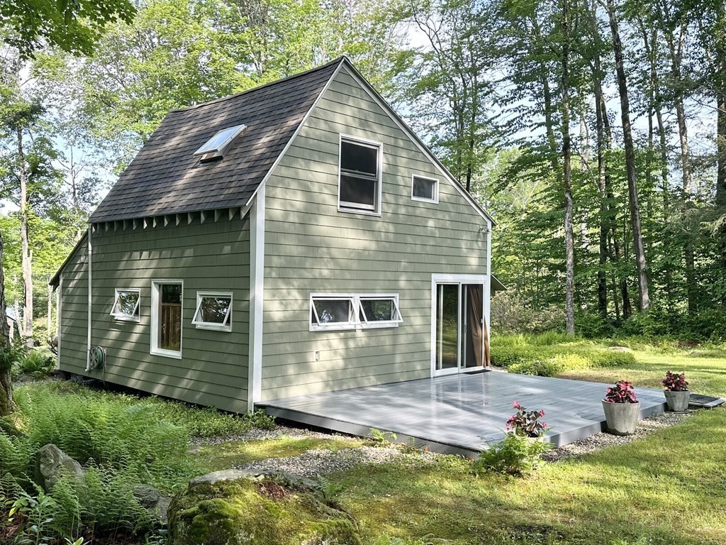 100 Aberdeen Road Goshen, MA 01096 - Photo 4 of 27 a view of a house with backyard and trees