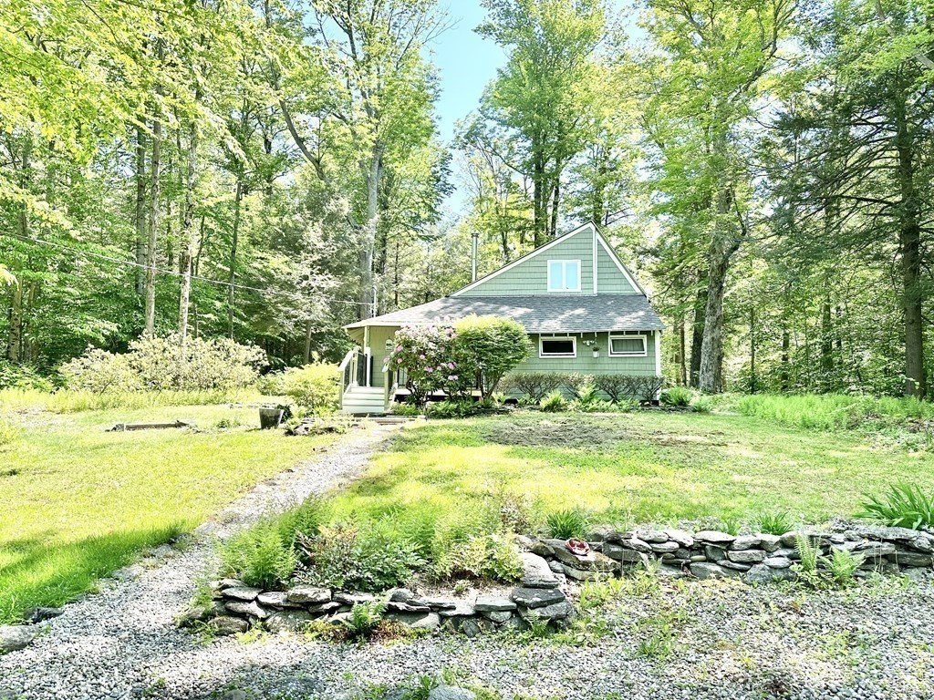 100 Aberdeen Road Goshen, MA 01096 - Photo 5 of 27 a backyard of a house with a yard and outdoor seating