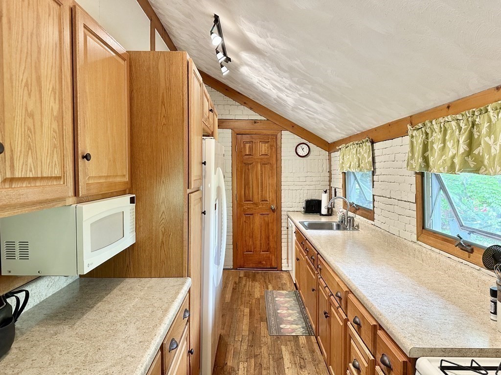 100 Aberdeen Road Goshen, MA 01096 - Photo 7 of 27 a spacious bathroom with a granite countertop sink and a large mirror