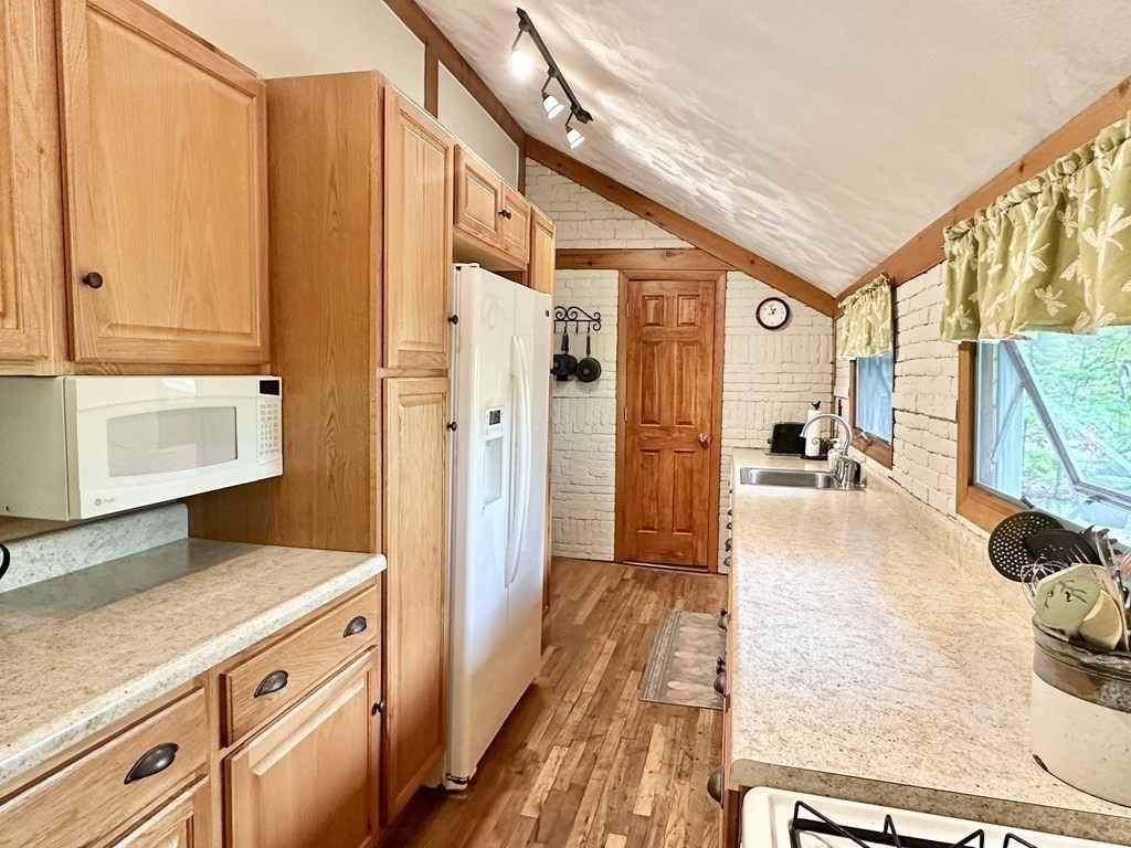 100 Aberdeen Road Goshen, MA 01096 - Photo 9 of 27 a kitchen with a refrigerator and a sink