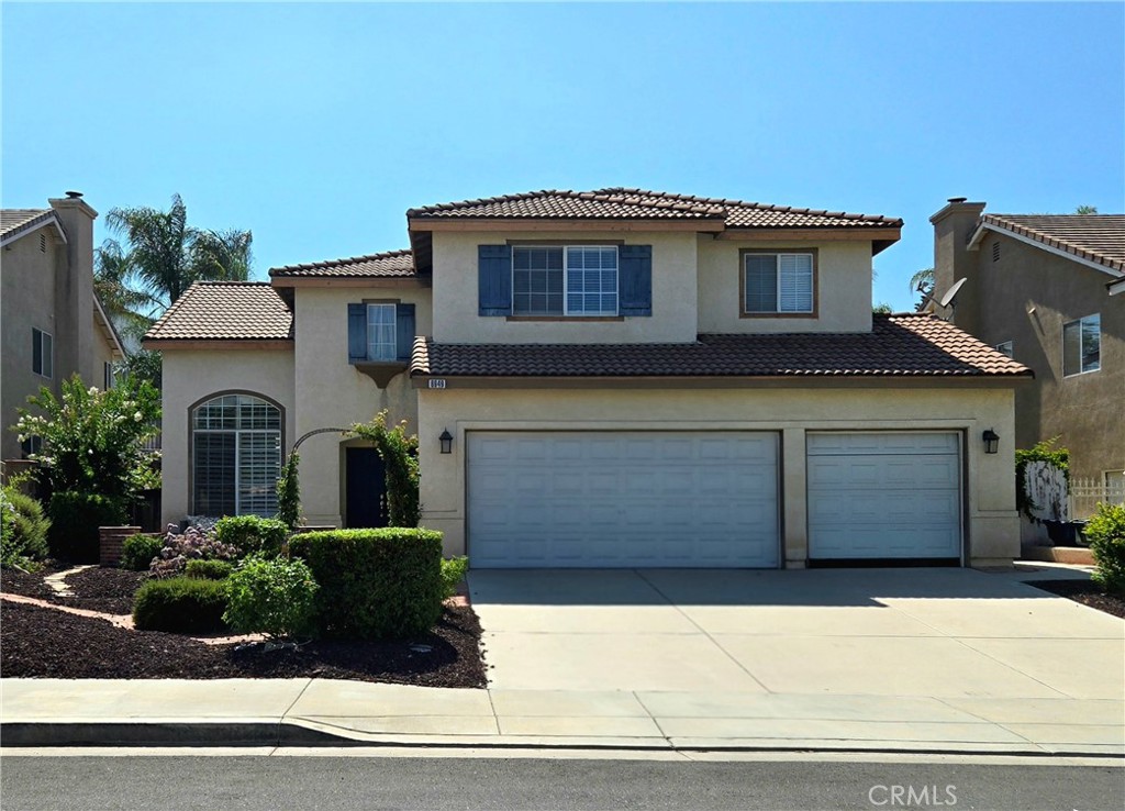 8949 Oakridge Court Riverside, CA 92508 - Photo 1 of 1 a front view of a house with a garden