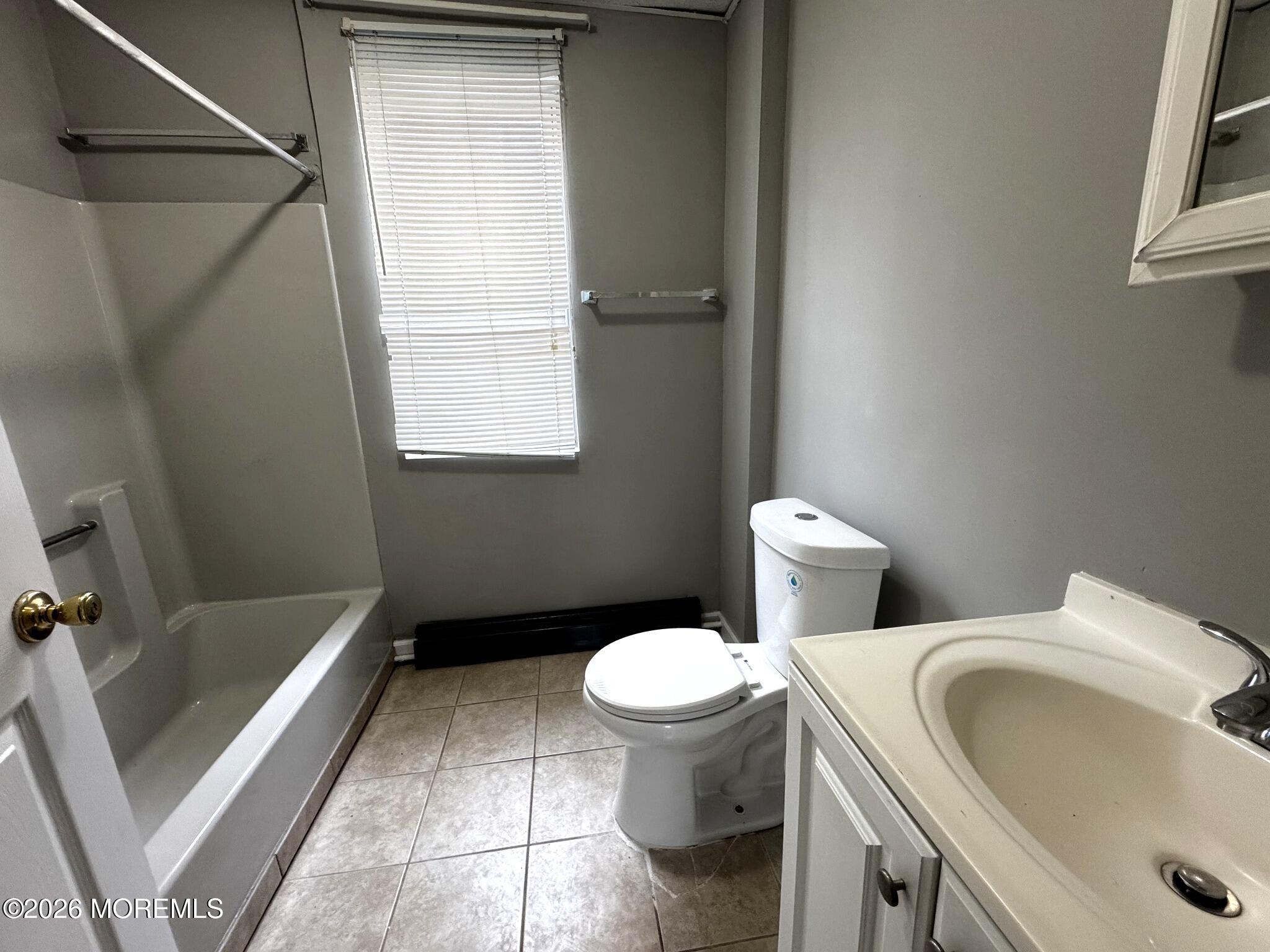 1830 East Riverside Drive Atlantic City, NJ 08401 - Photo 16 of 41 a bathroom with a sink and a toilet