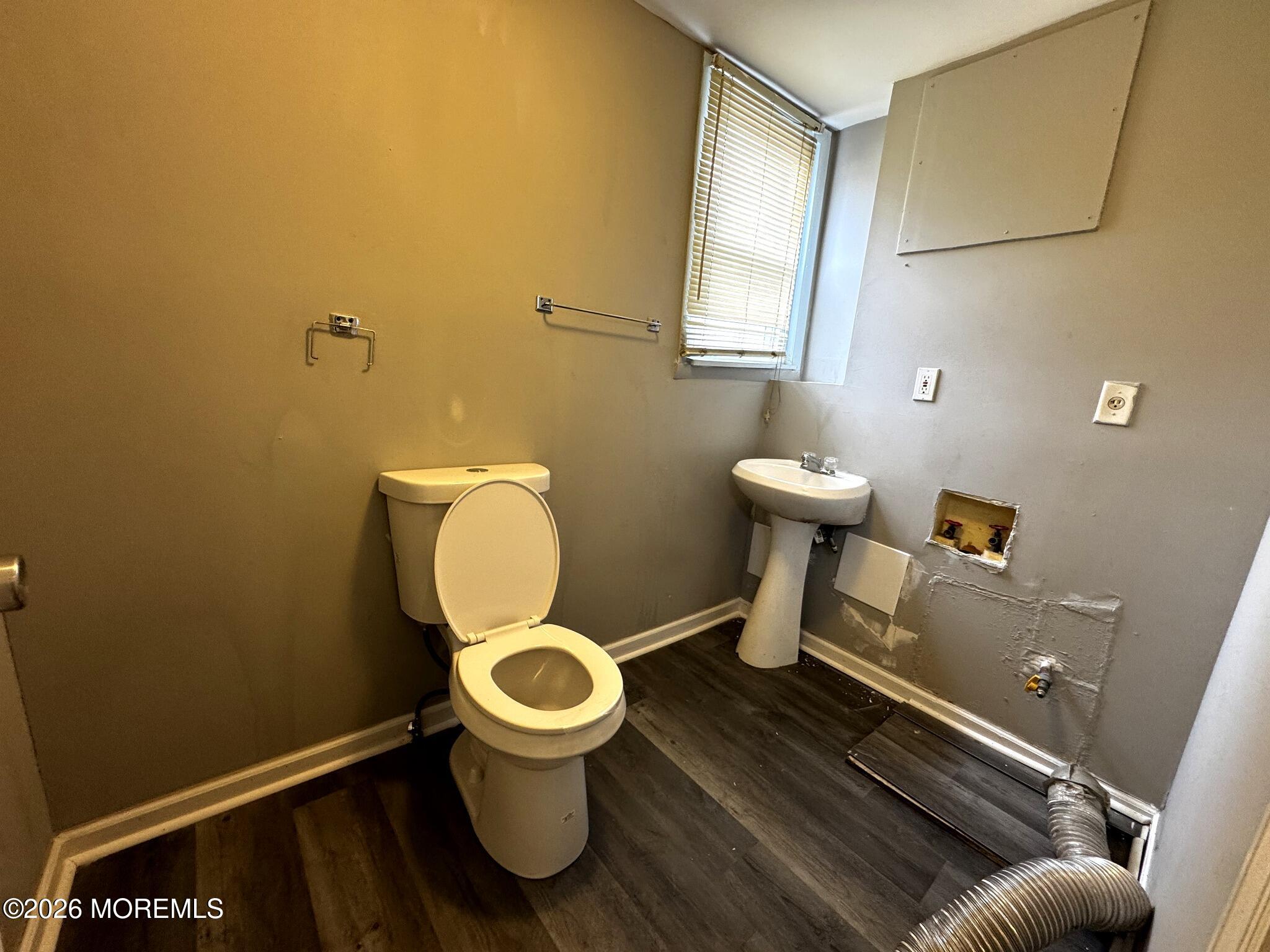1830 East Riverside Drive Atlantic City, NJ 08401 - Photo 18 of 41 a bathroom with a toilet and a sink