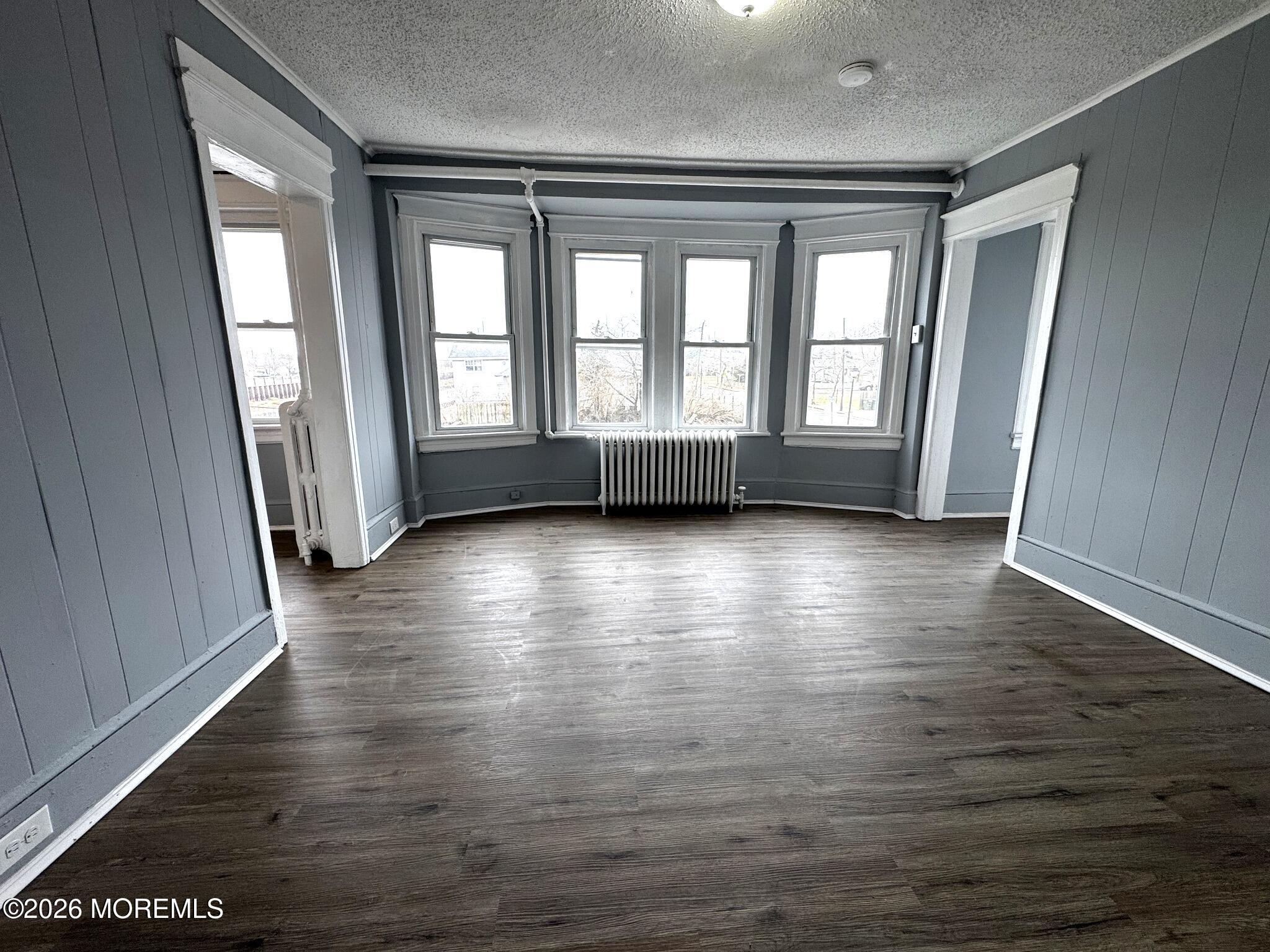 1830 East Riverside Drive Atlantic City, NJ 08401 - Photo 25 of 41 wooden floor in an empty room with a window