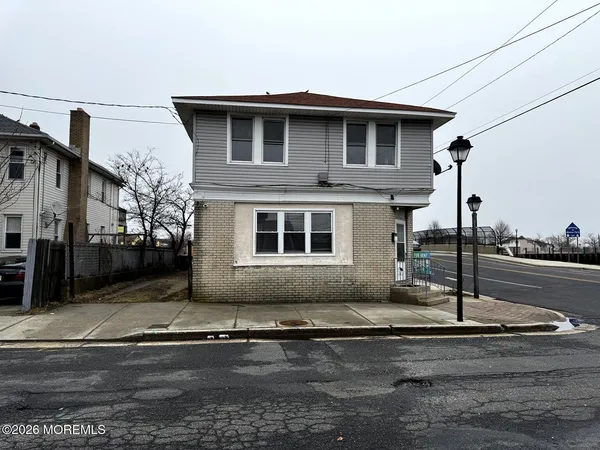 a front view of a house with street