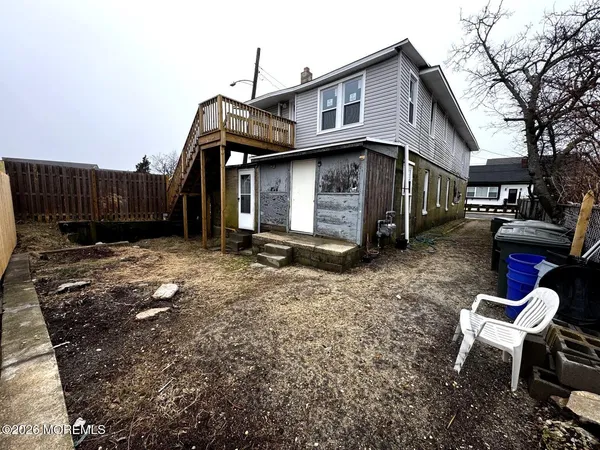 a house view with a backyard space